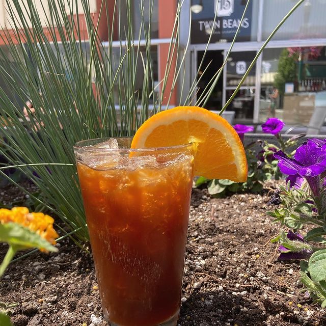 ice tea with an orange peal in it